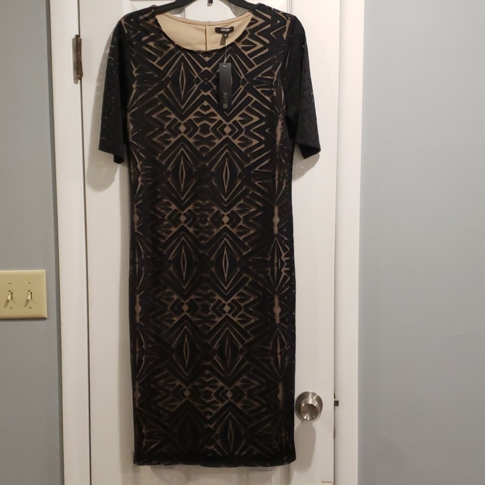 New with tags. 3/4 length sleeved dress
